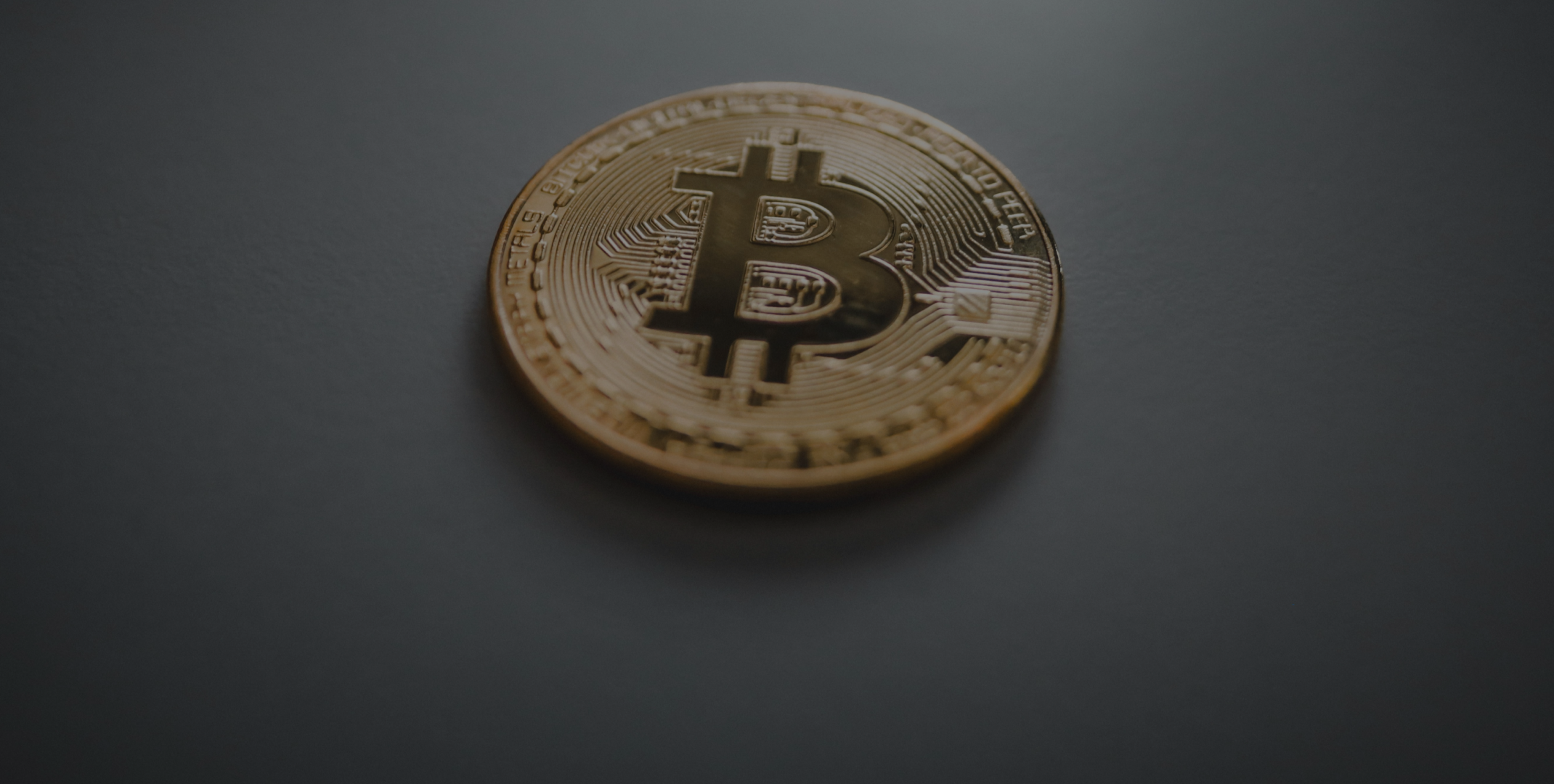 Physical Bitcoin coin representing stablecoin market transfer activity trends